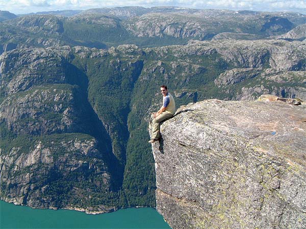 Some crazy nutter sitting above Kjerag and Lysefjord (photo by Jamie Lowe, apparently).